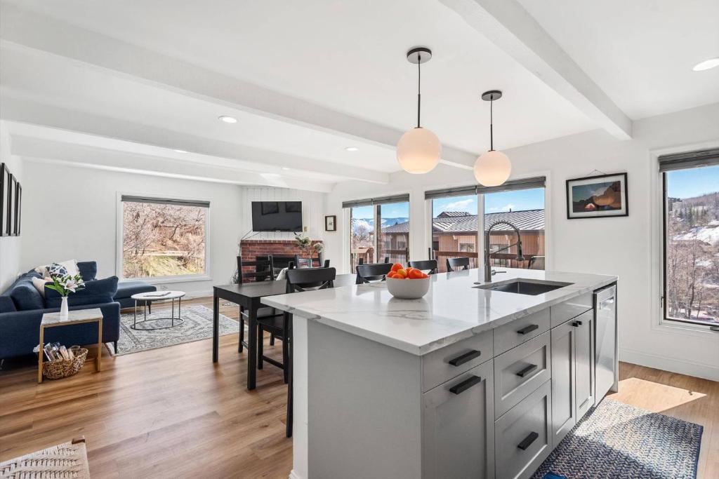 a kitchen and living room with a large counter top at Woodbridge 34 C in Snowmass Village