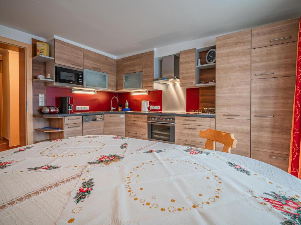 a kitchen with a large table in a room at Haus Christine in Niedernsill