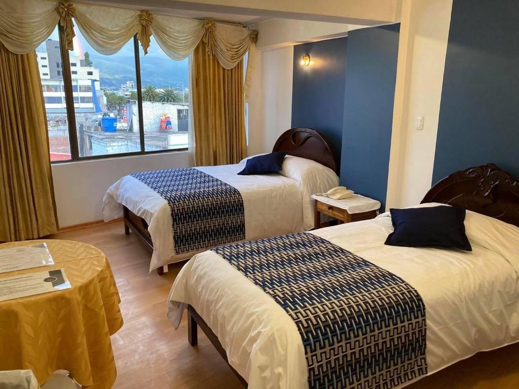 Postel nebo postele na pokoji v ubytování Hotel El Cisne Internacional