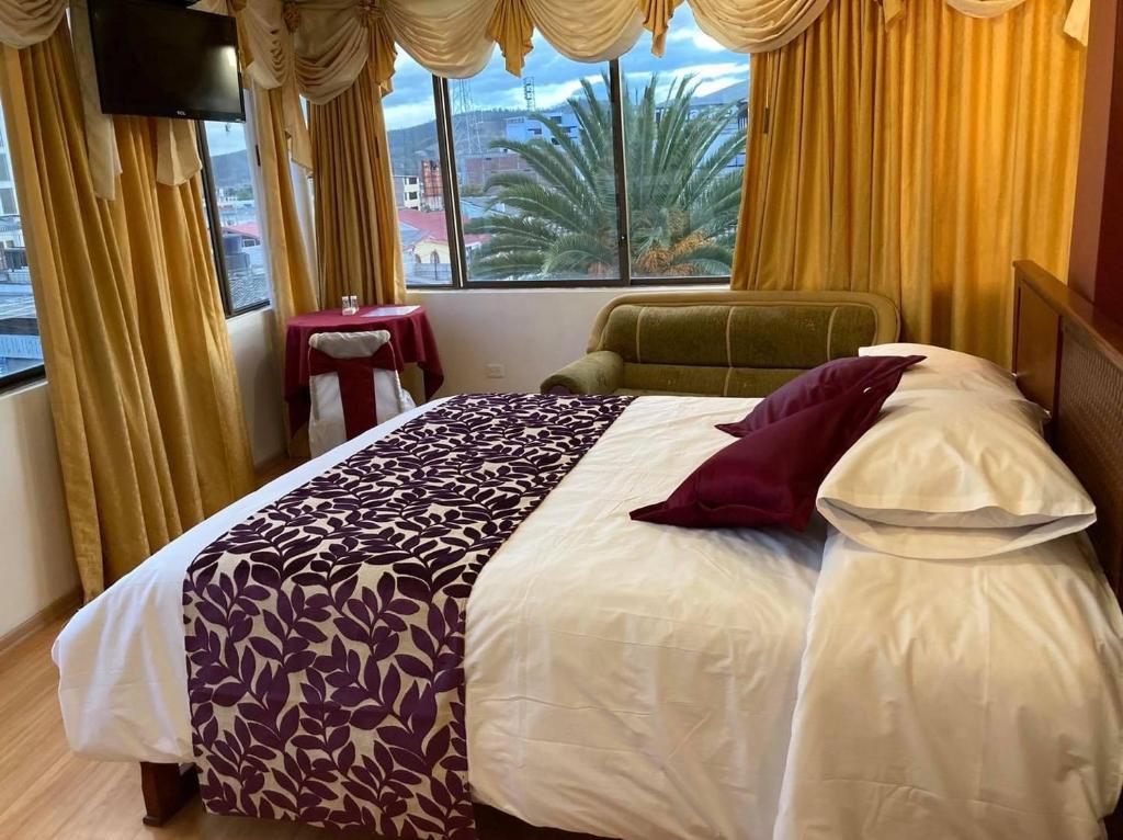 Postel nebo postele na pokoji v ubytování Hotel El Cisne Internacional