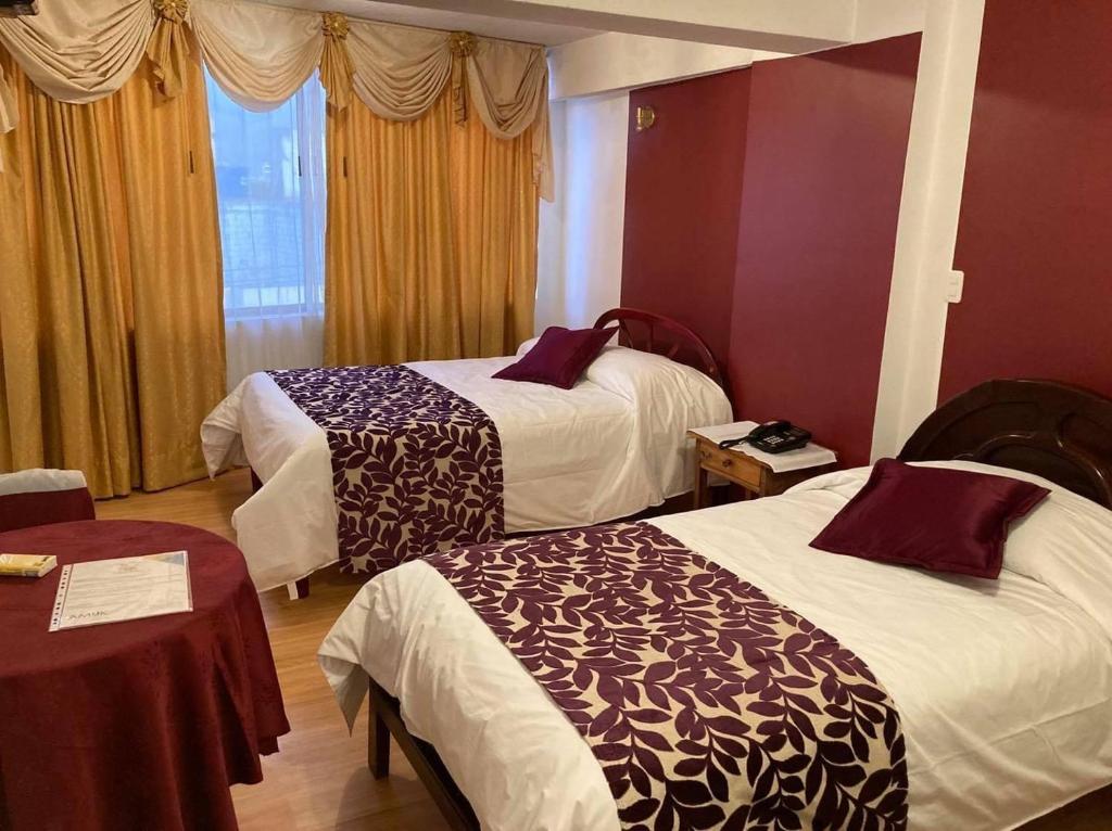 Postel nebo postele na pokoji v ubytování Hotel El Cisne Internacional
