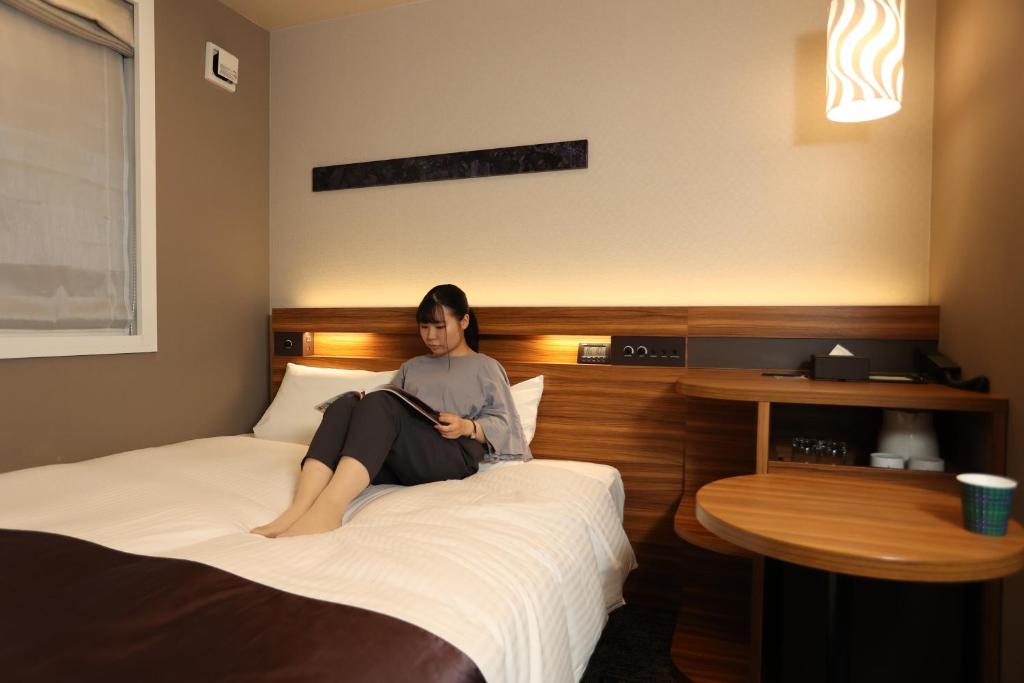 Postel nebo postele na pokoji v ubytování Urban Hotel Kyoto Shijo Premium