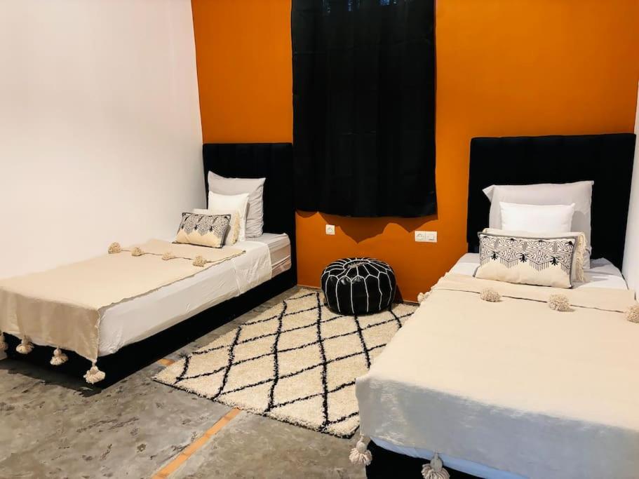 Ένα ή περισσότερα κρεβάτια σε δωμάτιο στο Loft Marrakech 5 min du centre super emplacement