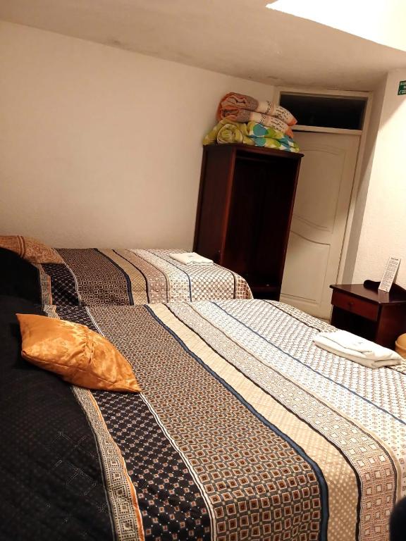 Postel nebo postele na pokoji v ubytování Hostal Almagro