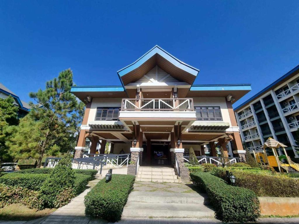 a large house with a balcony on a building at PY Suites Tagaytay in Tagaytay