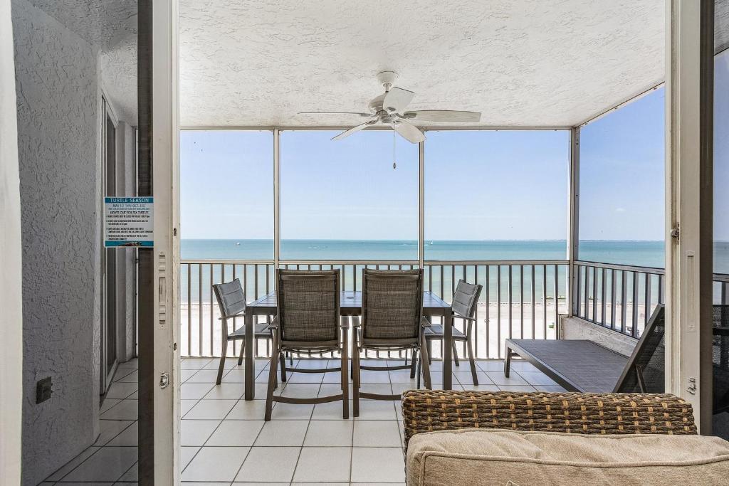 a dining room with a view of the ocean at Fantastic Gulf Front Condo on the North End of the Island - Beach Villas # 504 condo in Fort Myers Beach