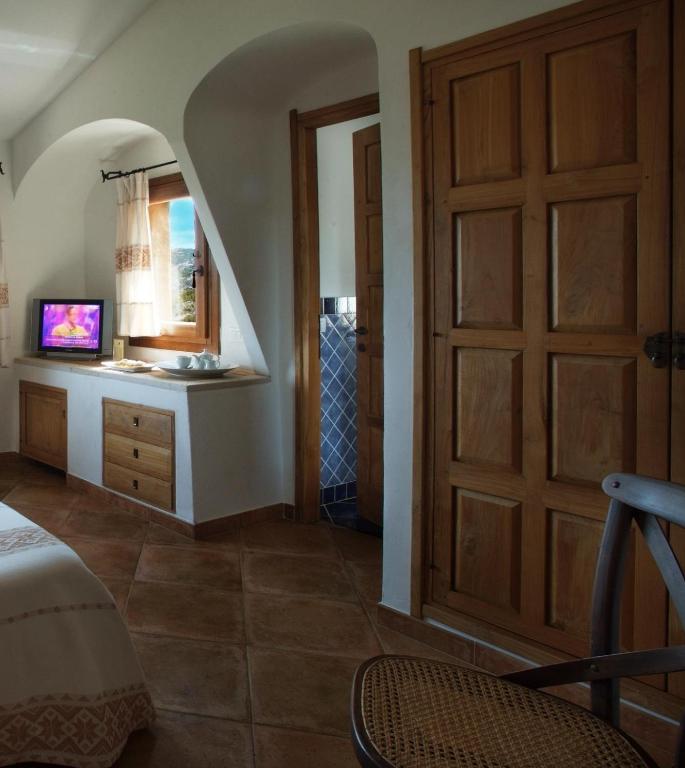Postel nebo postele na pokoji v ubytování Hotel Arathena