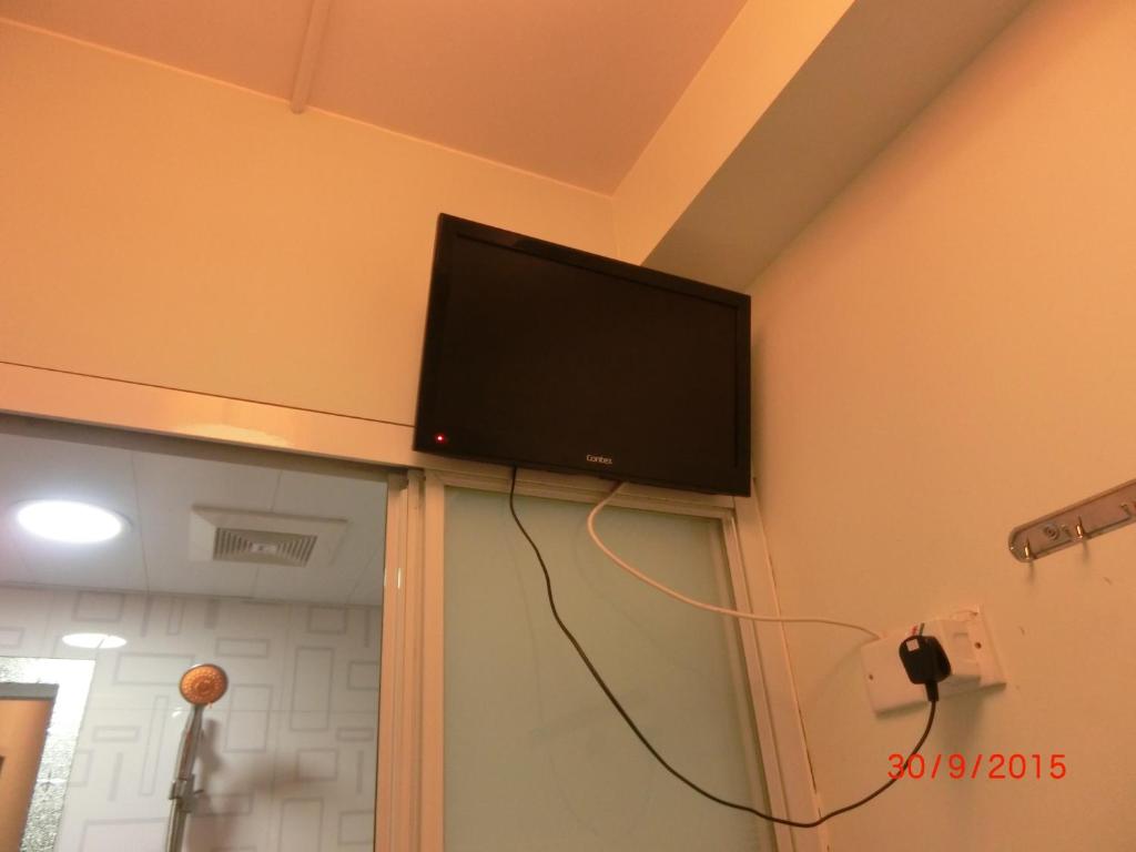 Televiisor ja/või meelelahutuskeskus majutusasutuses Li Cheng Guesthouse
