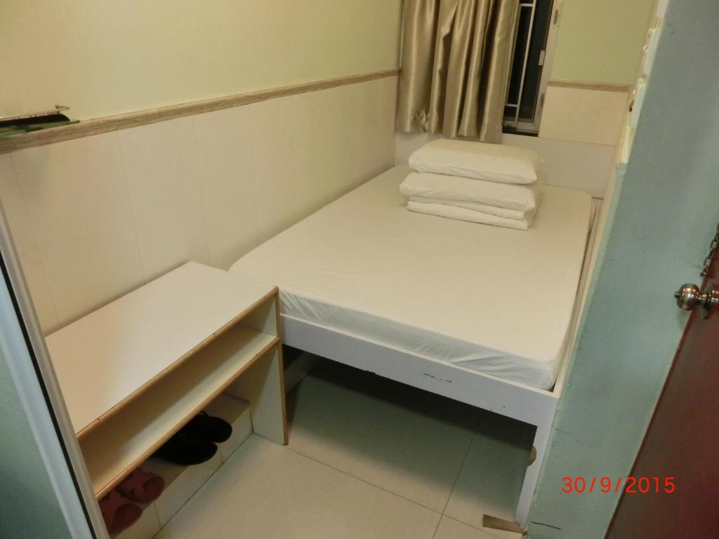 Voodi või voodid majutusasutuse Li Cheng Guesthouse toas