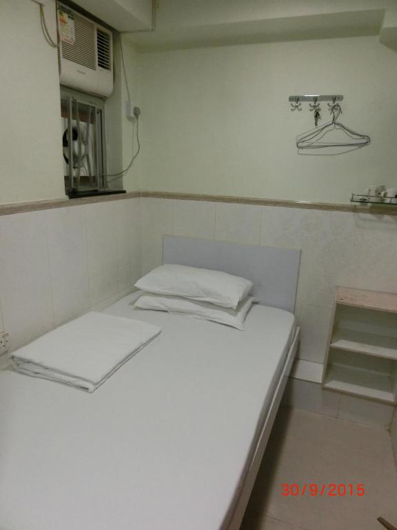 Voodi või voodid majutusasutuse Li Cheng Guesthouse toas