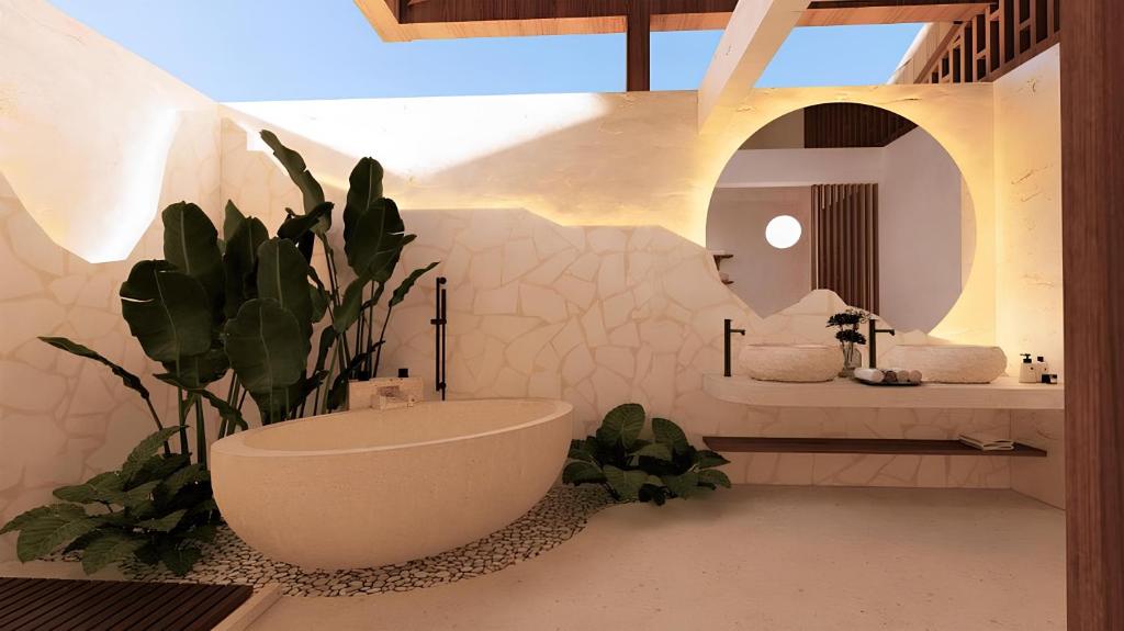 ein Bad mit einem Waschbecken und einem WC in einem Zimmer in der Unterkunft Lovina Haven Boutique Resort in Lovina