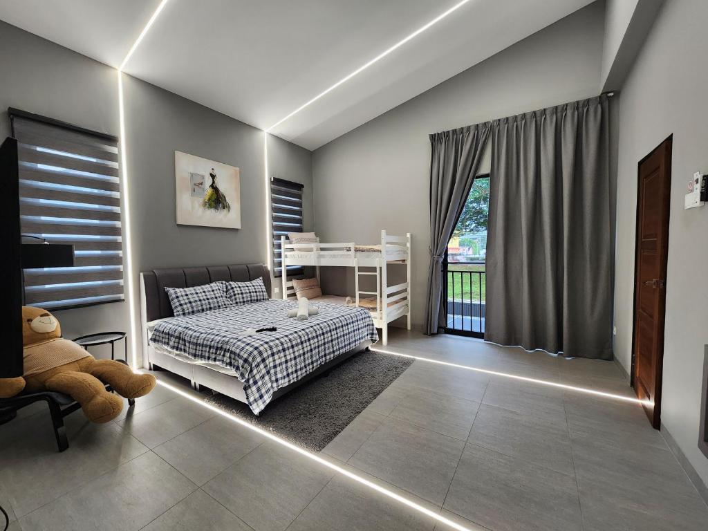 Postel nebo postele na pokoji v ubytování Ipoh Eden Pool Villa Suites