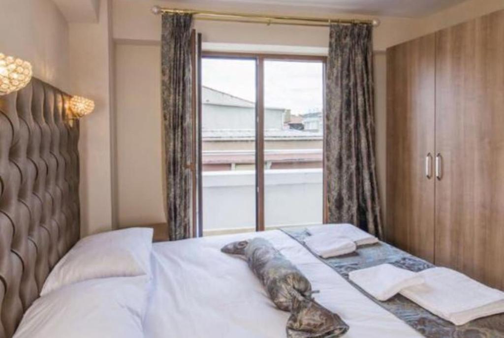 Postel nebo postele na pokoji v ubytování Beyzas Boutique Hotels Suites