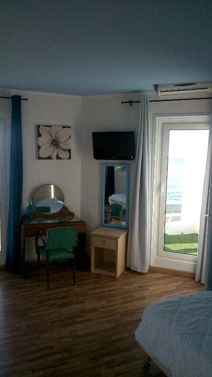 Postel nebo postele na pokoji v ubytování Hotel Ariana