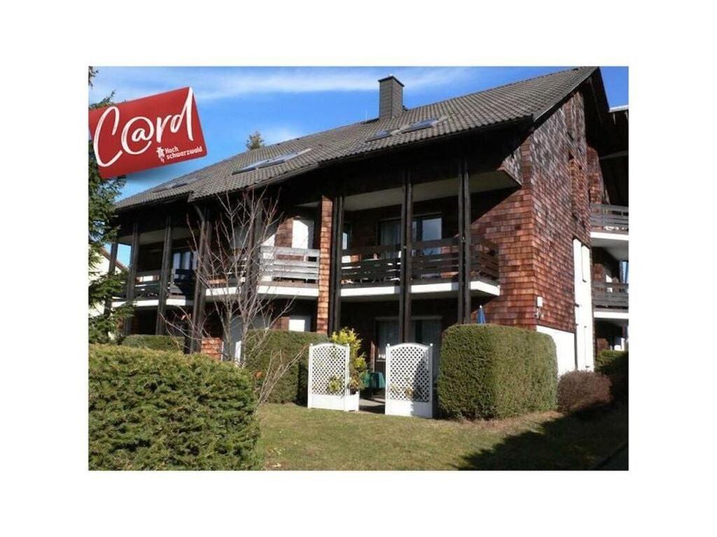 a building with a coca cola sign on it at Huis Rieslehof Appartement 12 in Titisee-Neustadt