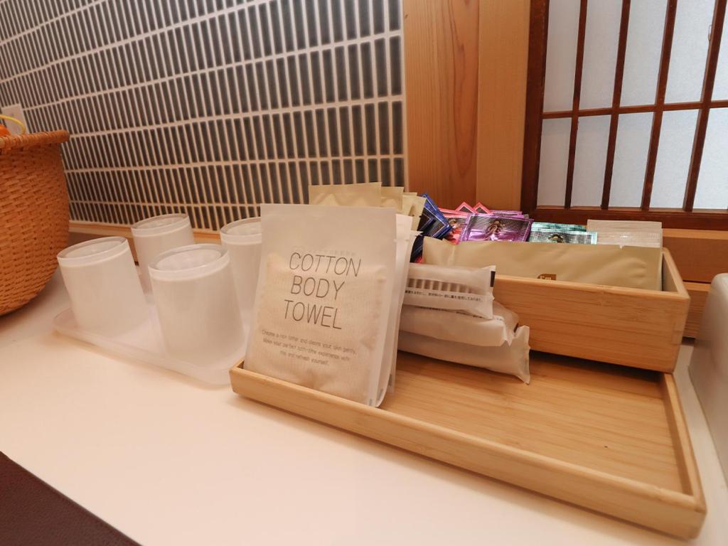 a kitchen counter with a book on a cutting board at A-UN lNN 会津若松 人気観光地へ車で10分 in Aizuwakamatsu