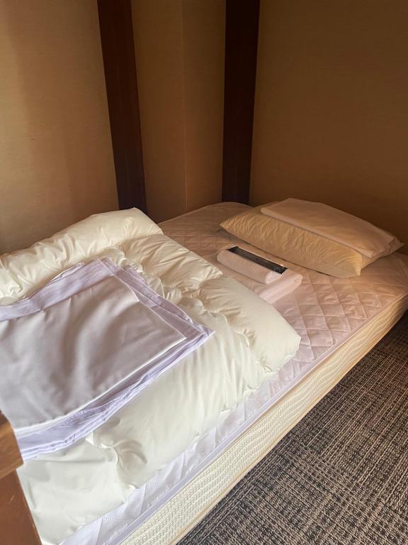 Postel nebo postele na pokoji v ubytování KOMOREBI HOSTEL-your cozy place-