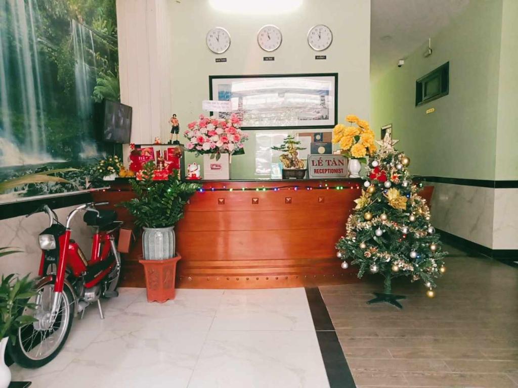 a flower shop with a christmas tree on the counter at Mi Linh Hotel in Nha Trang