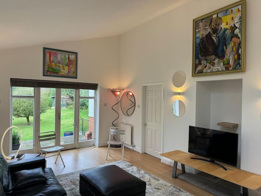 Et opholdsområde på Weybridge garden cottage