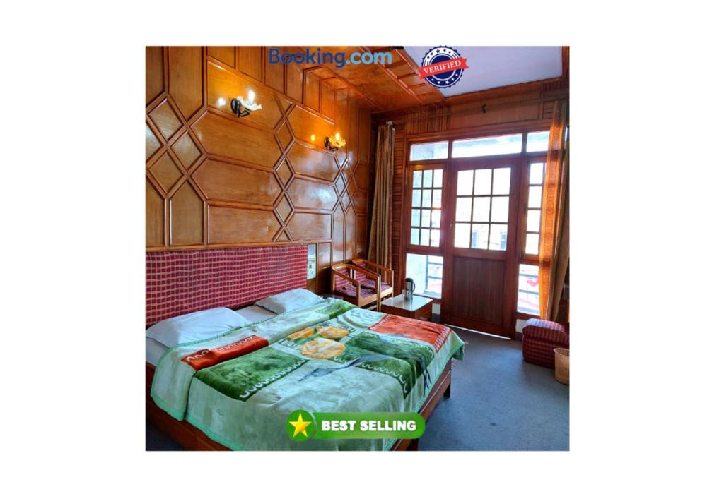 a bedroom with a bed in a room at Goroomgo Radha Continental Nainital Near Naini Lake - Excellent Customer Service in Nainital