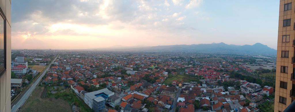 an aerial view of a city with houses and mountains at Inapin Aja by Dio Property in Bandung