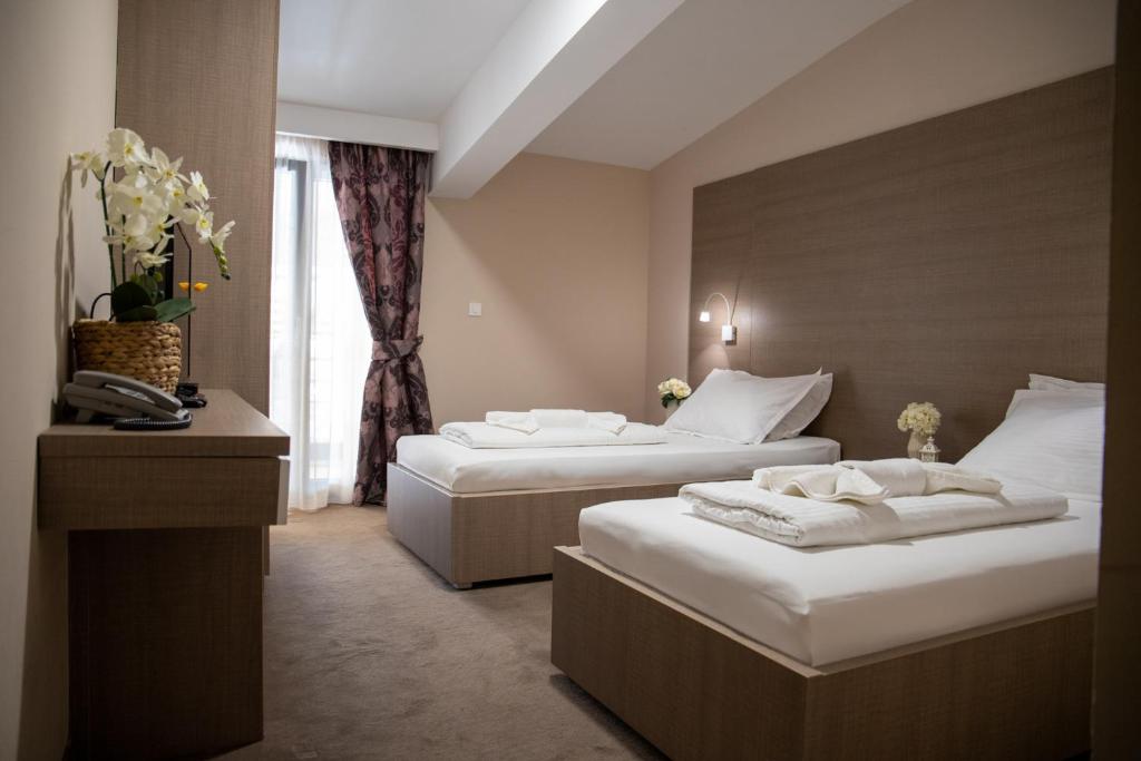 Postel nebo postele na pokoji v ubytování Hotel Narenta