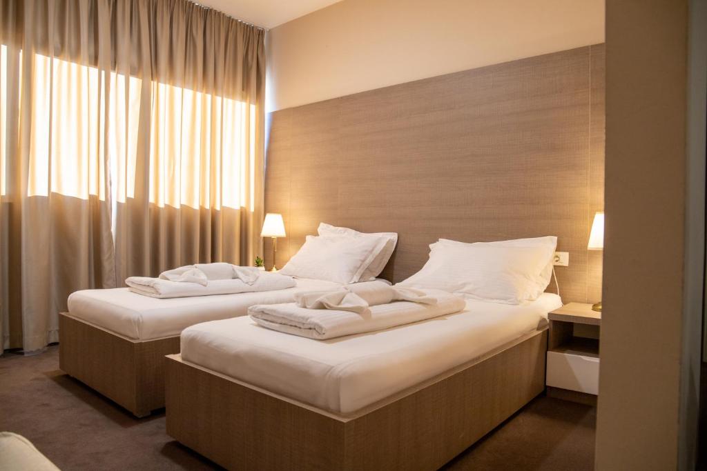 Postel nebo postele na pokoji v ubytování Hotel Narenta