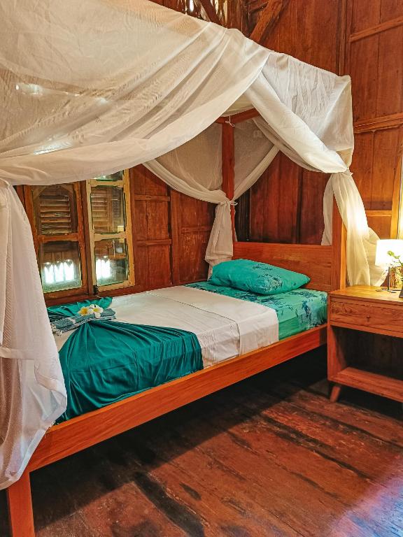 Postel nebo postele na pokoji v ubytování Alaya Ecolodge