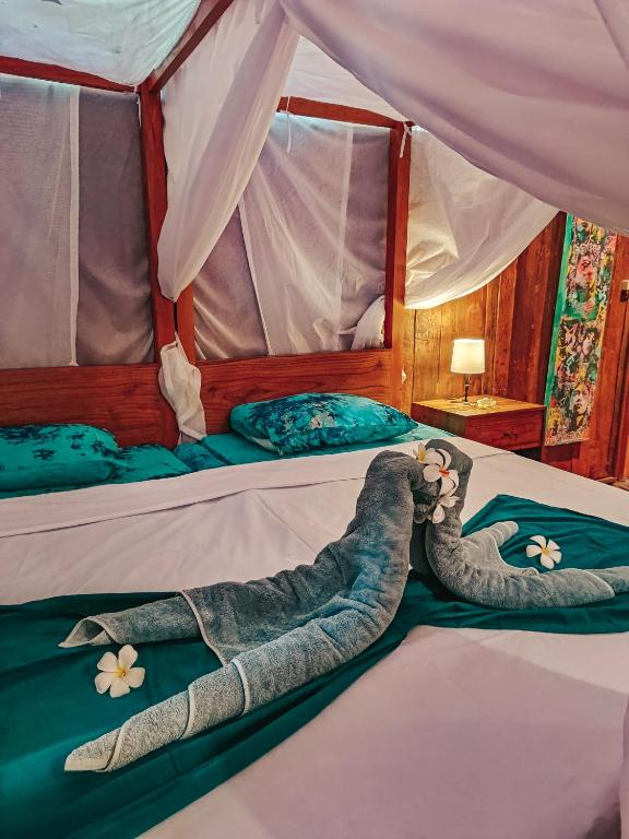 Postel nebo postele na pokoji v ubytování Alaya Ecolodge