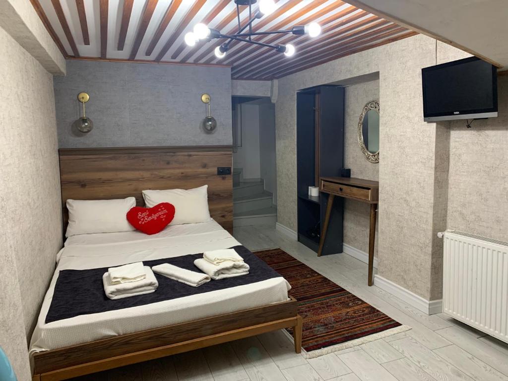 Postel nebo postele na pokoji v ubytování Valeria House