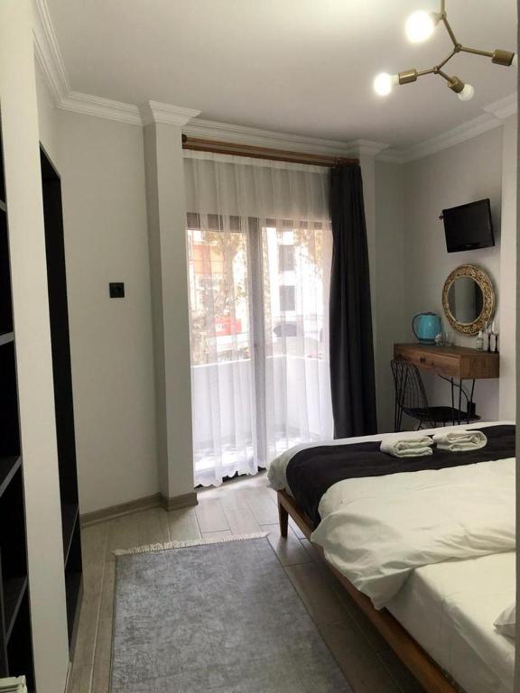 Postel nebo postele na pokoji v ubytování Valeria House