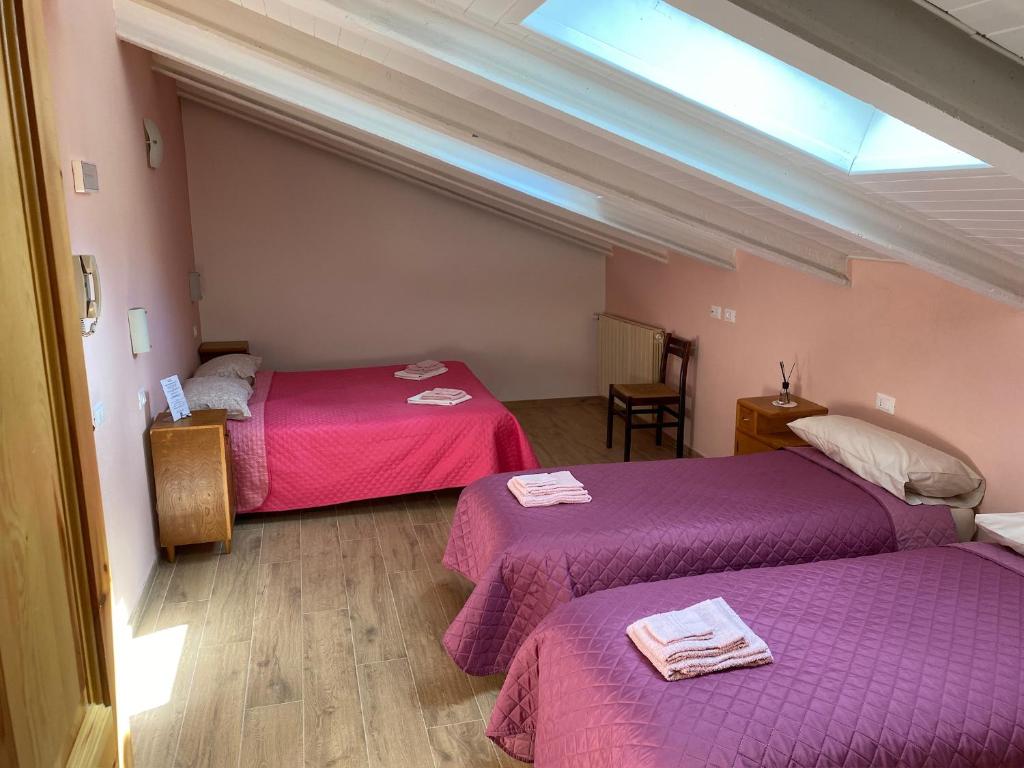 Postel nebo postele na pokoji v ubytování La Buca delle Fate Ristorante Albergo