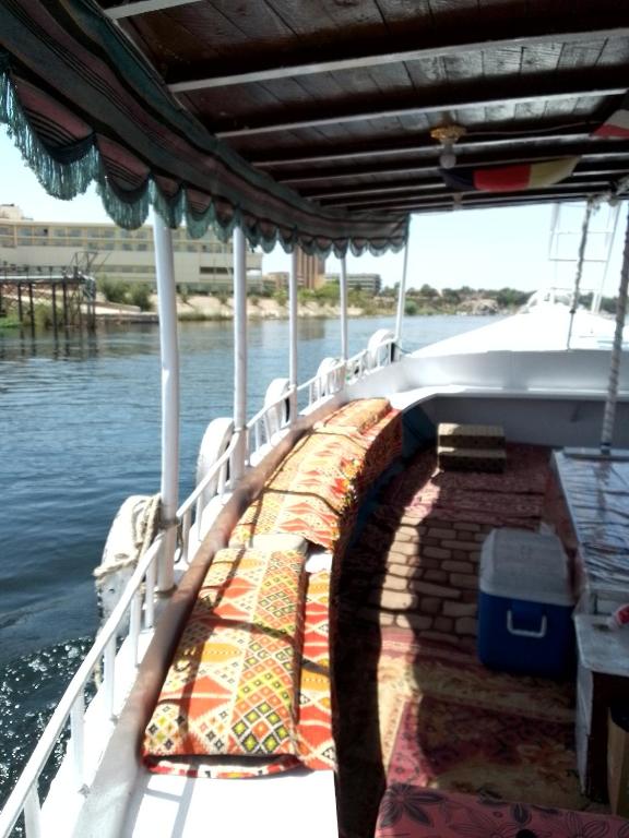 a boat that is sitting in the water at Ozzy Tourism in Aswan