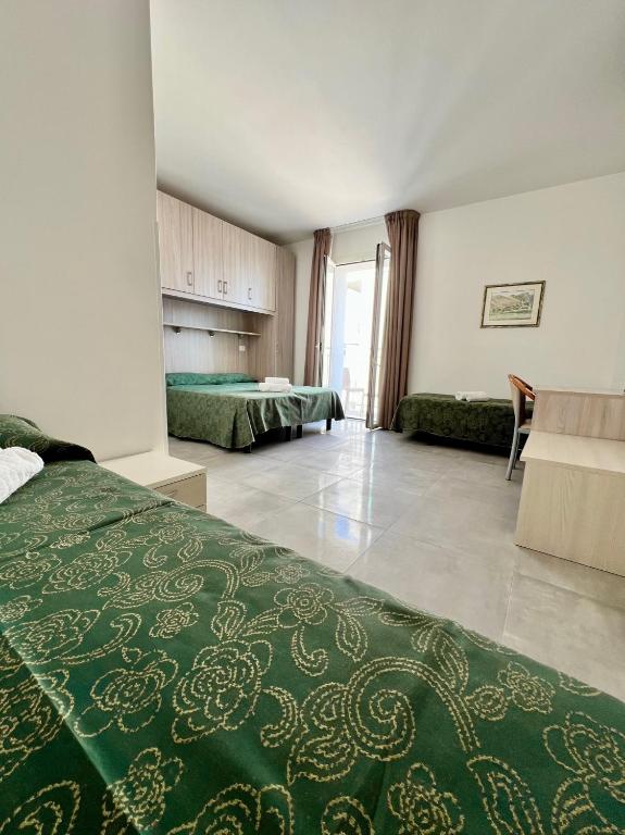 Postel nebo postele na pokoji v ubytování Hotel Terramare