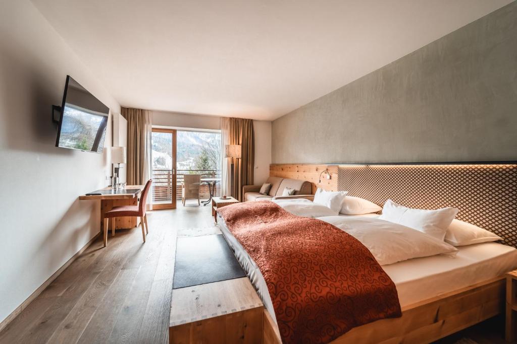 Postel nebo postele na pokoji v ubytování Naturhotel Leitlhof