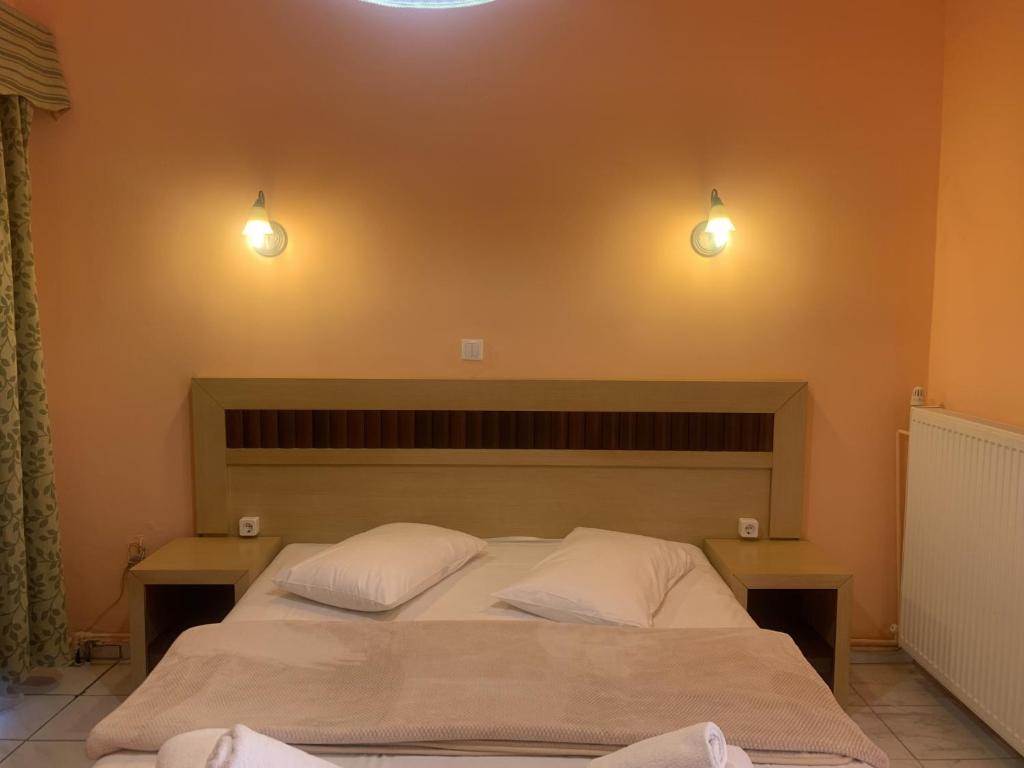 Postel nebo postele na pokoji v ubytování Polychrono Beach Hotel