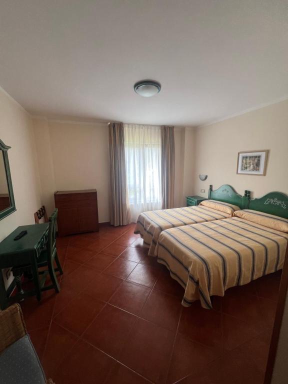 Postel nebo postele na pokoji v ubytování Hotel Gavitu