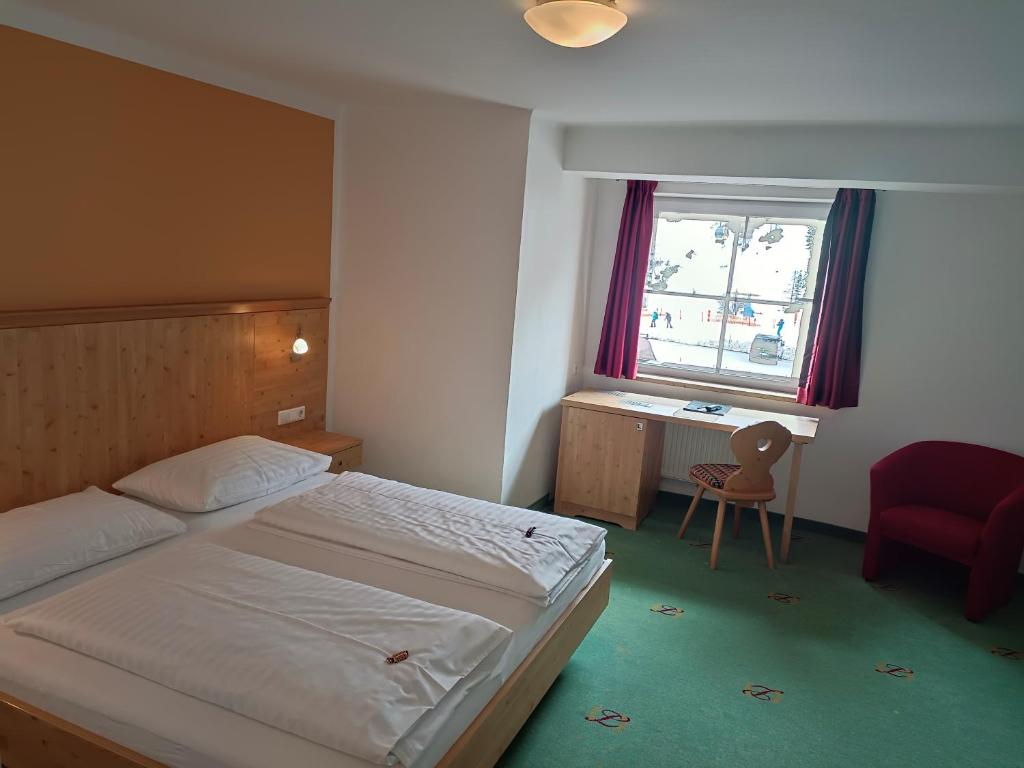 Postel nebo postele na pokoji v ubytování Hotel Grünwaldkopf