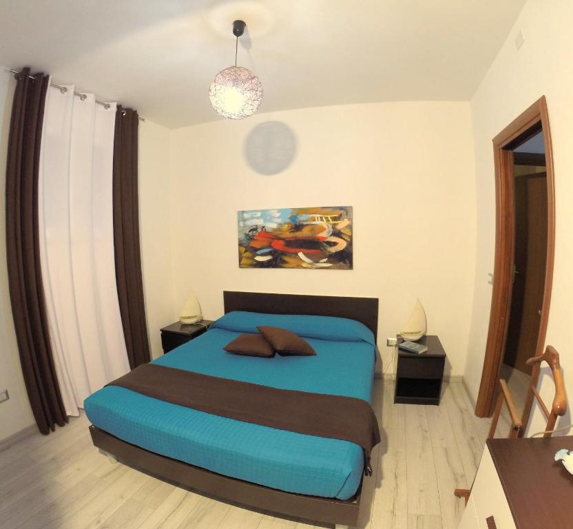 Katil atau katil-katil dalam bilik di Appartamento in villa