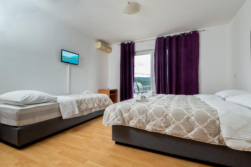 Postel nebo postele na pokoji v ubytování Studio & Apartments More