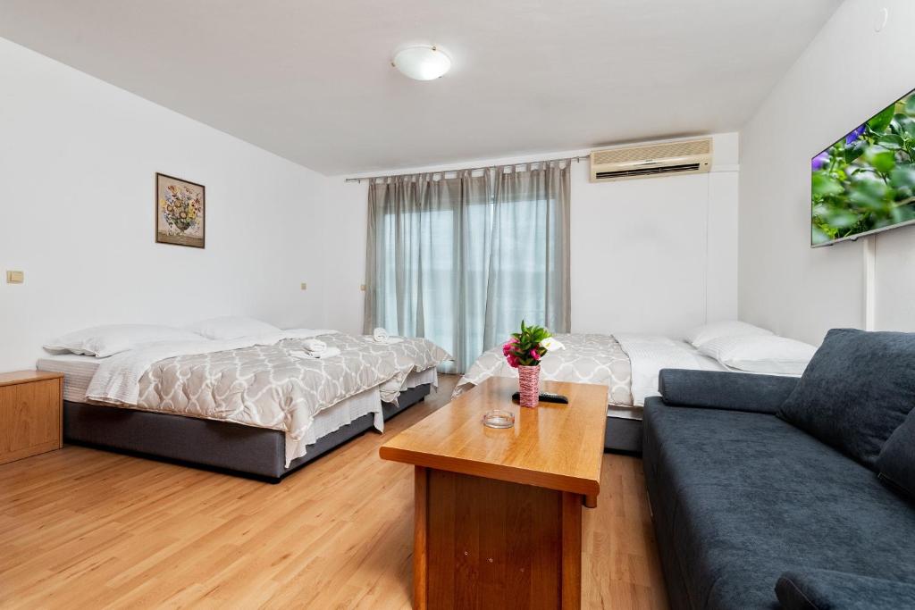 Postel nebo postele na pokoji v ubytování Studio & Apartments More