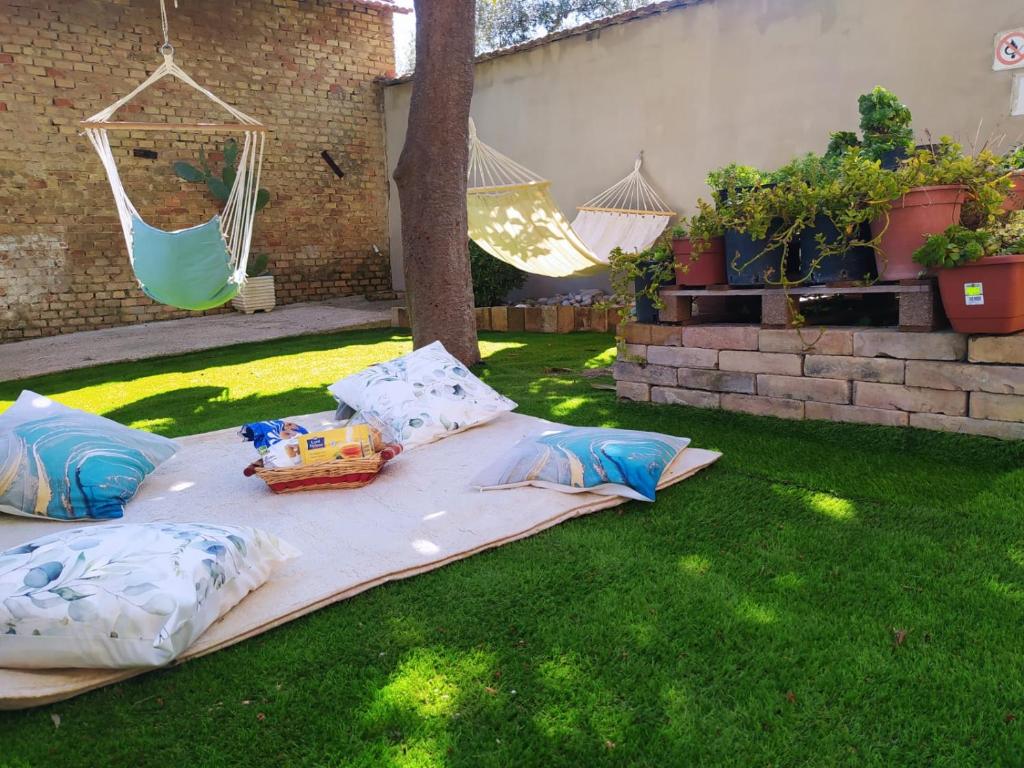 a blanket on the grass with a toy on it at Il giardino degli Ulivi house in Ortona