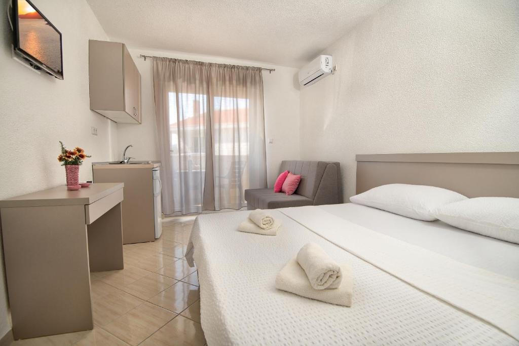Postel nebo postele na pokoji v ubytování Studio & Apartments More