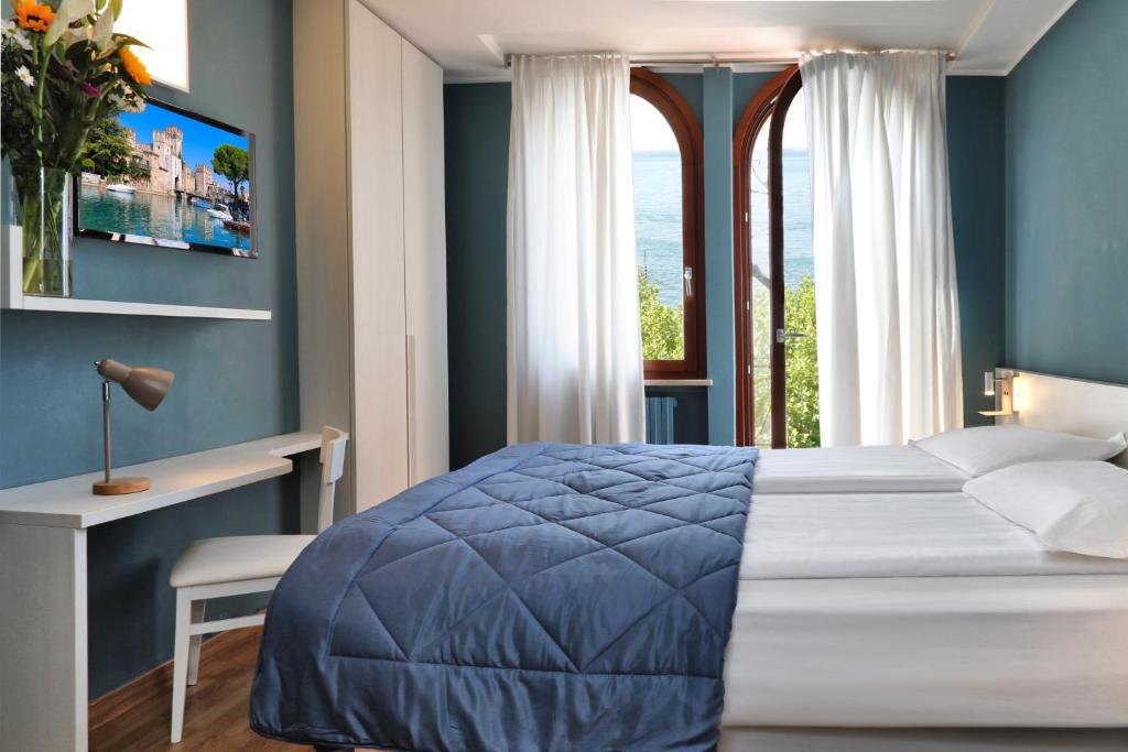 Postel nebo postele na pokoji v ubytování Albergo All'Ancora