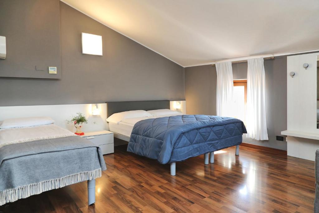 Postel nebo postele na pokoji v ubytování Albergo All'Ancora