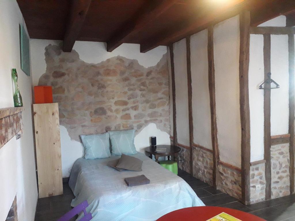 Postel nebo postele na pokoji v ubytování Chambre double