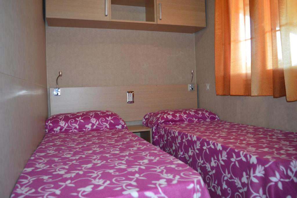 Postel nebo postele na pokoji v ubytování Camping Royal