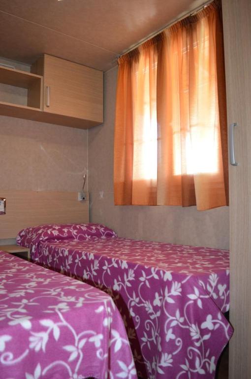 Postel nebo postele na pokoji v ubytování Camping Royal