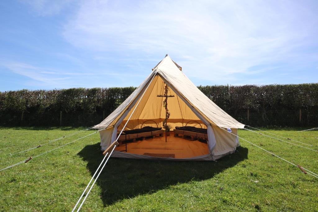 a tent in the middle of a field at Rescorla Retreats - Ivory in St Austell