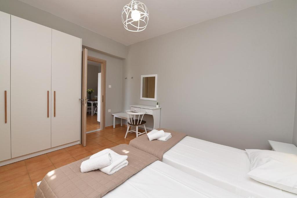 Postel nebo postele na pokoji v ubytování Cyclamen Apartments